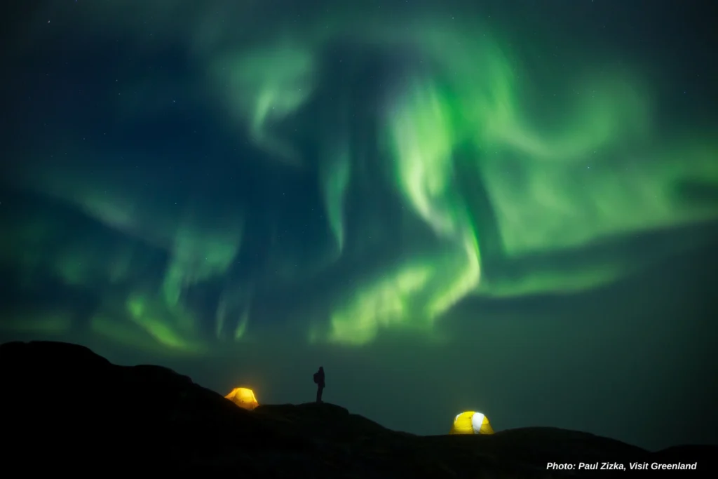 Backpacker outside tent. Photo - Paul Zizka , Visit Greenland
