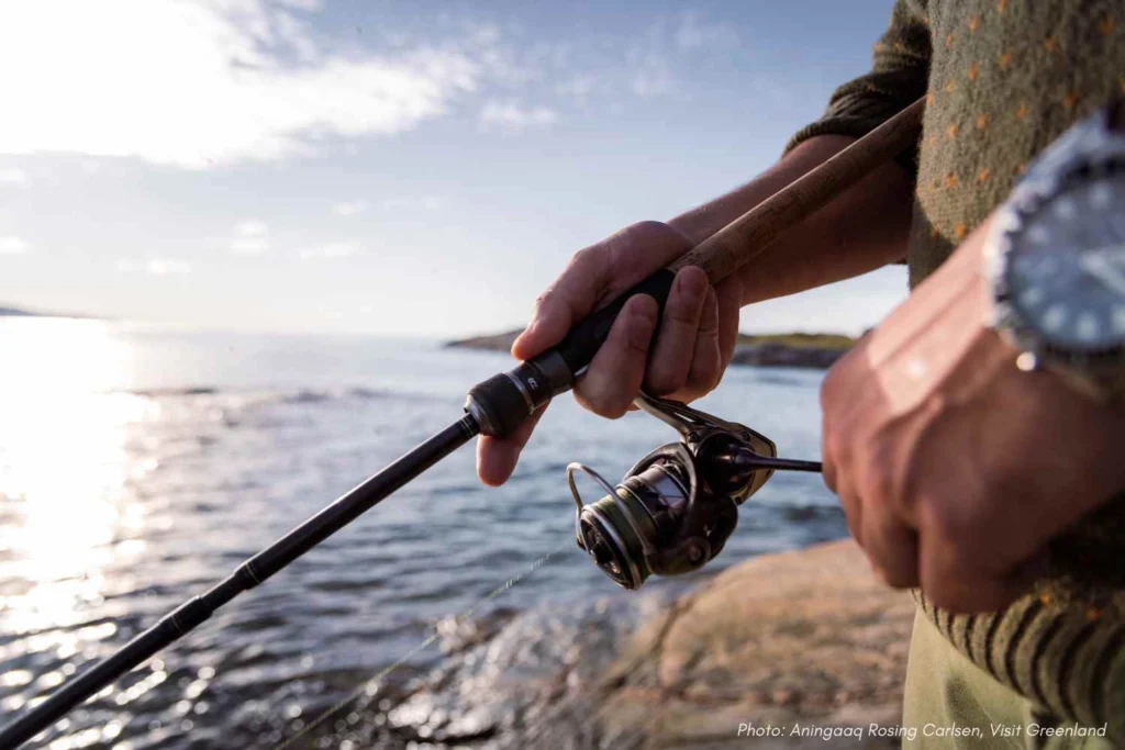 Fishing by the shore. - Photo by Aningaaq Rosing Carlsen - Visit Greenland