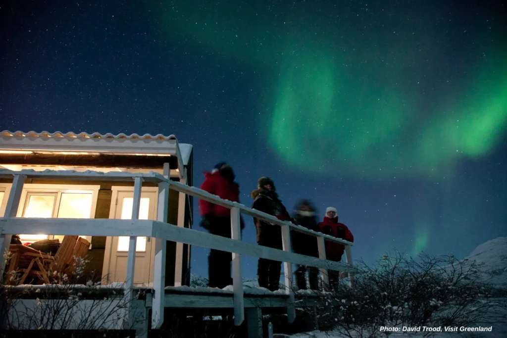 Kangerlussuaq northern lights at a hut. Photo - David Trood, Visit Greenland