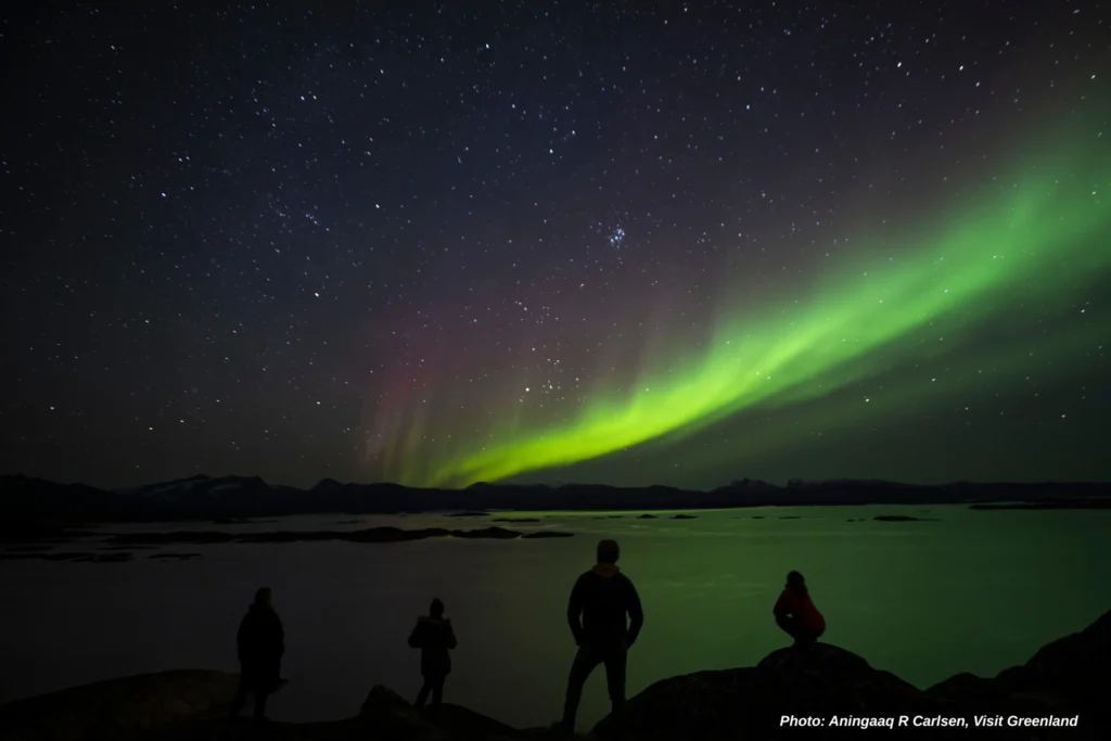 The four enjoying the nightsky from the top of the thoughsand stairs. Photo by Aningaaq Rosing Carlsen