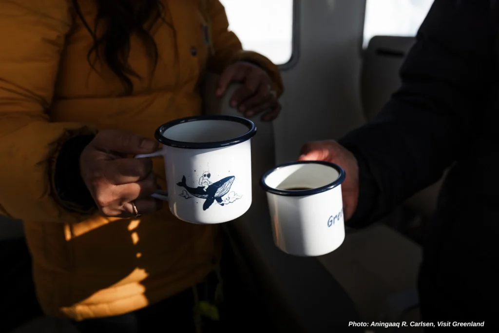 A cup of coffee on a boat tour in the Arctic - Photo by Aningaaq R. Carlsen - Visit Greenland