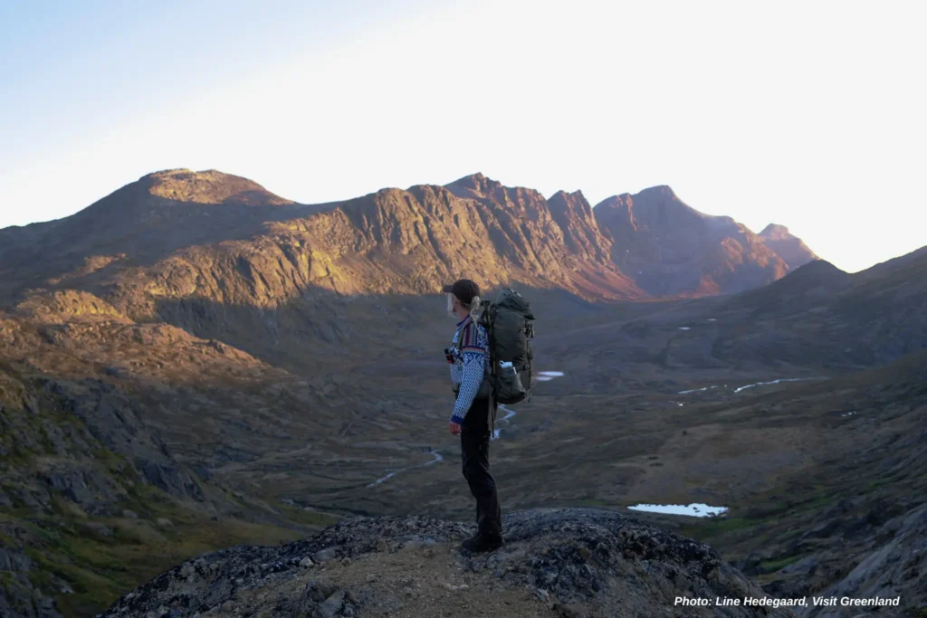 Enjoying the sunset towards Alanngorsuaq. Photo by Line Hedegaard - Visit Greenland