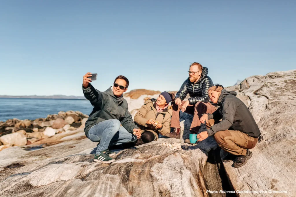 Friends Taking Selfie at Beach, Nuuk. Photo - Rebecca Gustafsson , Visit Greenland