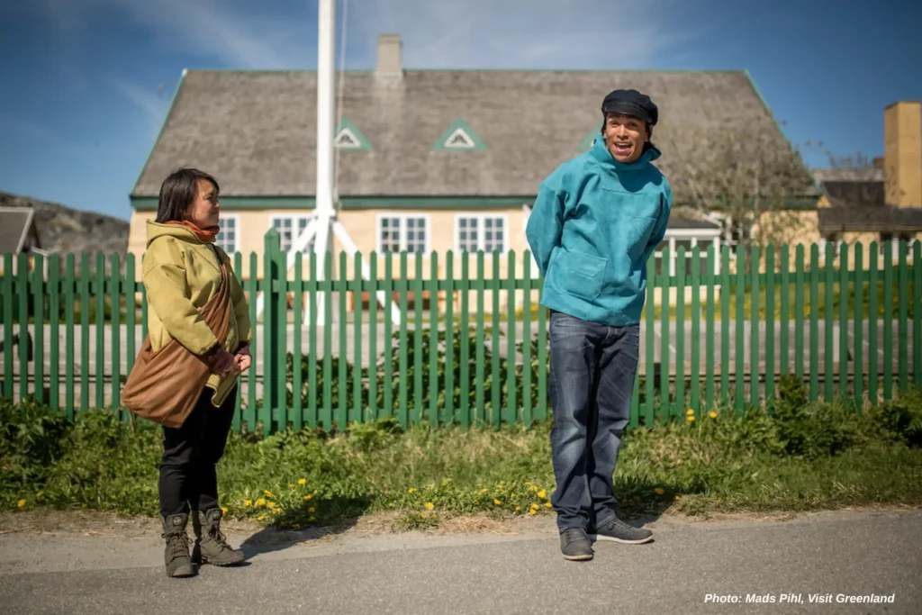 Two actors recreating historical events in the old colonial part of Nuuk in Greenland