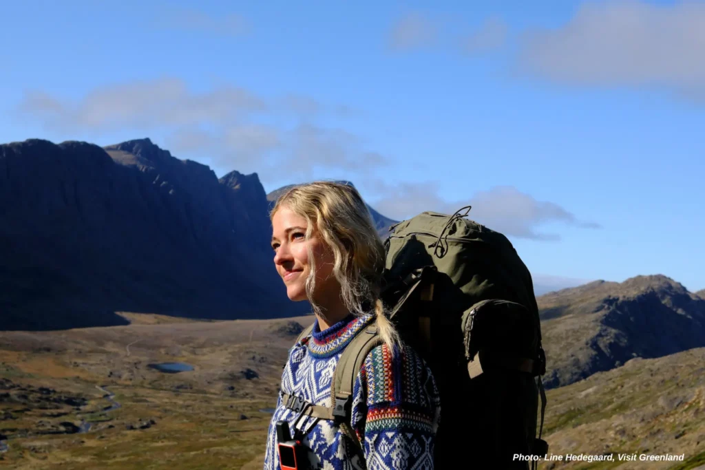 Woman hiker all packed up. Photo by Line Hedegaard - Visit Greenland