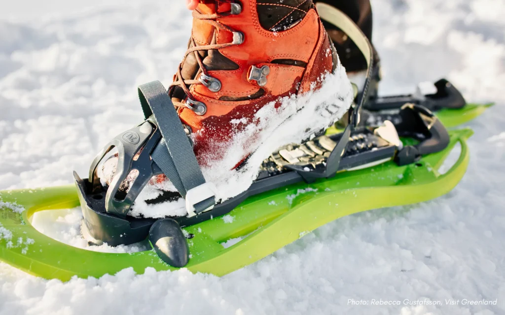 Showshoe equiptment on hiking boot for back-country winter hike in Nuuk in Greenland