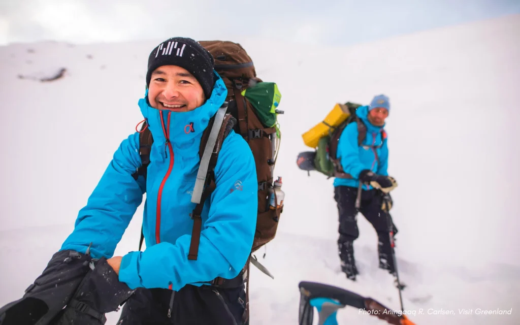 Two Ravens guide Adam on a snowshoe hike